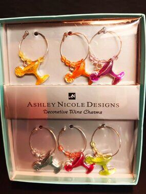 Ashley Nicole designs charming decorative wine charms, set of six.